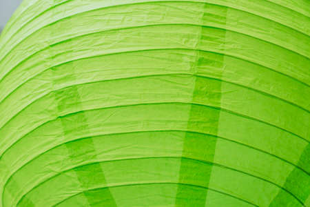 close up of green paper chinese lantern as background