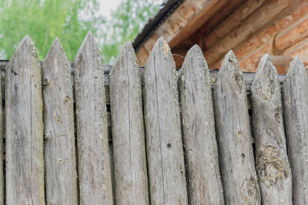 old peeled wooden fence close up