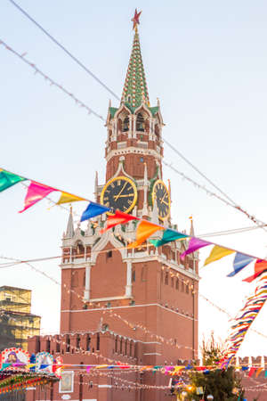 Spasskaya tower of Kremlin and festive decorations on Red Square in Moscowの写真素材