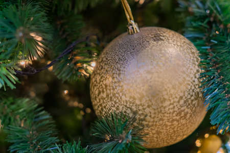 Christmas and New Year holidays background. Christmas tree decorated with golden balls. Celebration conceptの写真素材