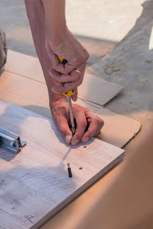 furniture assembling - Carpentry screws for a knock down wooden table.
