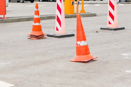 traffic cones in the middle of the street. traffic safety and roadwork signsの写真素材