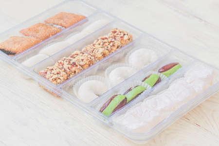 Traditional turkish delight in a plastic box. Assorted Oriental sweets.の写真素材