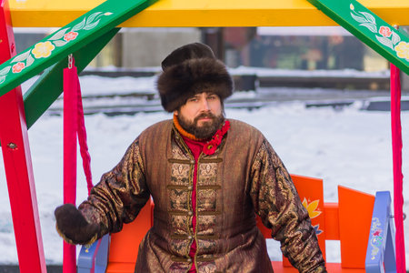 MOSCOW, RUSSIA - FEBRUARY 13, 2018: Portrait of a man in national costume. Shrovetide celebration in Moscow city centerのeditorial素材