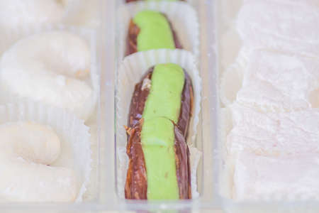 Traditional turkish delight in a plastic box. Assorted Oriental sweets.の写真素材