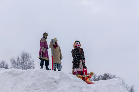 Moscow Region, Russia - February 18, 2018: Celebration of Russian Shrovetide. Burning of scarecrow for the honor of winter end.のeditorial素材