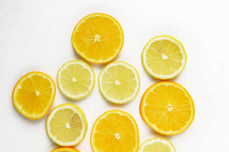 citrus slice, oranges and lemons isolated on white backgroundの写真素材