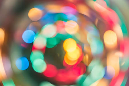 Abstract burred texture background of colorful bokeh motion. Long exposure of small neon lightsの写真素材