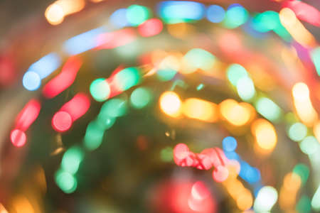 Abstract burred texture background of colorful bokeh motion. Long exposure of small neon lightsの写真素材
