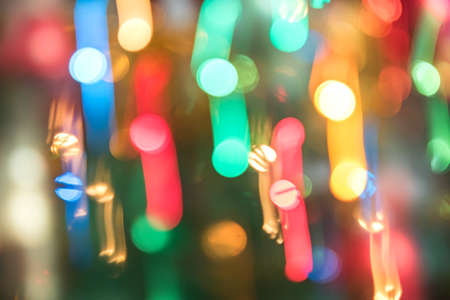 Abstract burred texture background of colorful bokeh motion. Long exposure of small neon lightsの写真素材