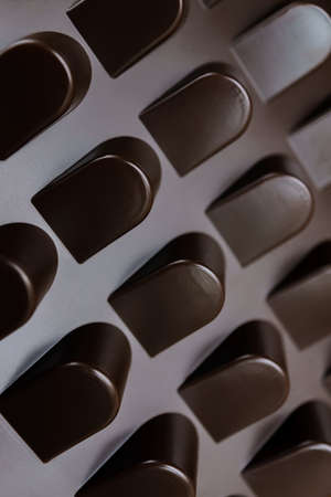 empty box of chocolate shapes. Abstract texture backgroundの写真素材