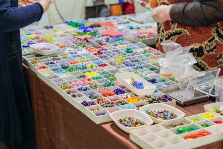 Colorful mix of lampwork glass beads. Variety of shapes and colors to make necklaces or bracelets. DIY materials at the marketの写真素材