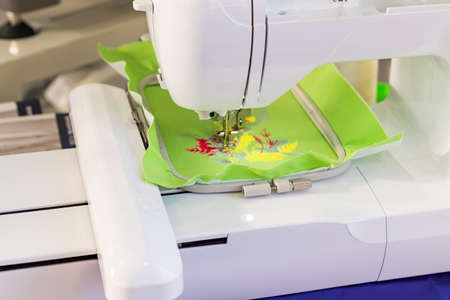 Sewing machine close up. Process of automatic embroideryの写真素材