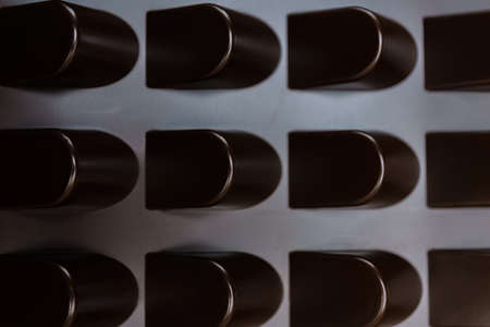 empty box of chocolate shapes. Abstract texture backgroundの写真素材