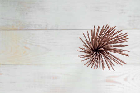 Raw soba noodle on whte wooden table. Traditional Japanese food. Top view, copy space