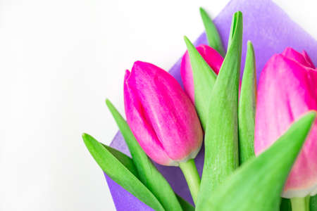 Beautiful spring bouquet of pink tulips on white backgrounsd. Top view.の写真素材