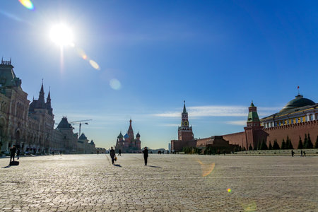 Moscow, Russia - March 03, 2019: Tourists walking on Red Square near GUM, St Basils Cathedral and...