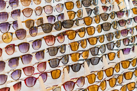 Moscow, Russia - April 03, 2019: Various different sunglasses in the shop display shelves. accessory and fashion conceptのeditorial素材