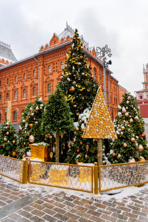Moscow, Russia - December 20, 2018: Christmas decorated Manezhnaya Square in a snowy day. Many christmas trees on Red Square backgroundのeditorial素材