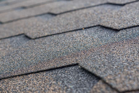 Roofing shingles background. Selective focus