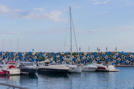 Sochi Adler, Russia - September 7, 2019: group of yachts are parked in the harbor in a summer day