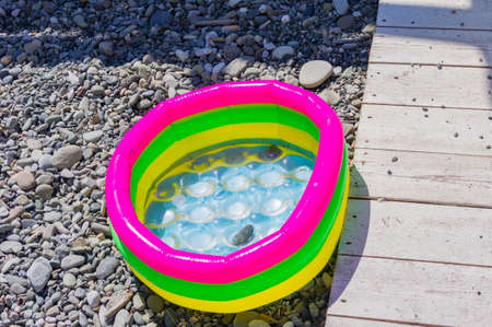 colorfull swimming pool for children on a beach.