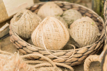 many skeins in a basket made of hemp. Fiber production.の写真素材