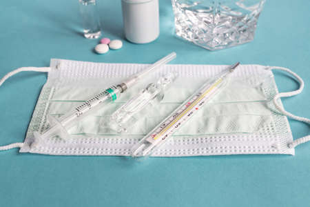 Virus Pandemic treatment. Medicines, capsules, thermometer and protective masks. Healthcare concept