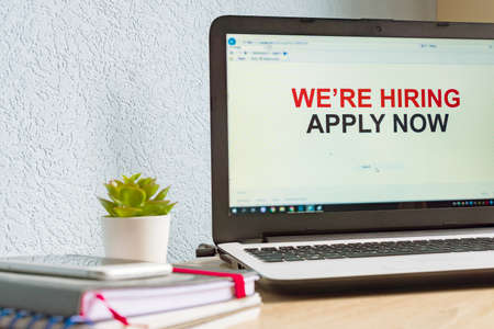 Online job seach. Home office. Notebook with open job searching page.の写真素材