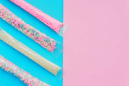 Set of sugar sprinkles of white, pink and blue colors in shape of stars, balls and butterflies....