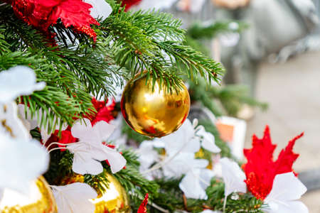 close up of christmas trees decoration with toys and garlands. Festive greeting card for winter holidaysの写真素材
