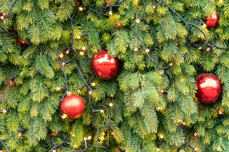 close up of christmas trees decoration with toys and garlands. Festive greeting card for winter...
