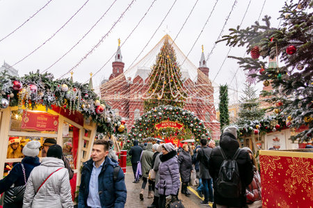 MOSCOW,RUSSIA - December 18, 2019: Christmas decorations on Red Square on background of Historical Museum. Winter Fair of christmas food and souvenirs. Moscow Seasons Projectのeditorial素材