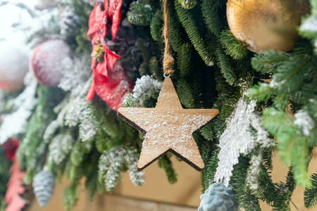 close up of christmas trees decoration with toys and garlands. Festive greeting card for winter...