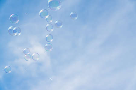 Abstract background, soap bubbles on blue sky background. Copy space for textの写真素材