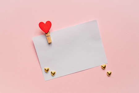 Love letter mockup. Greeting card with pin and red heart with copy space for text or design. Festive...