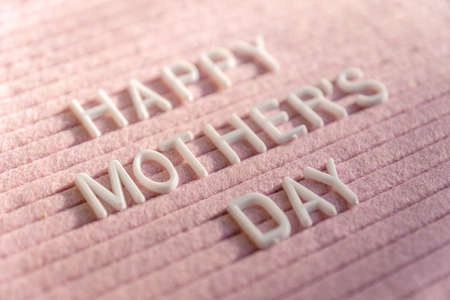 Words Happy Mother's Day on Pink Felt Letter Board. Festive composition fith selective focusの写真素材