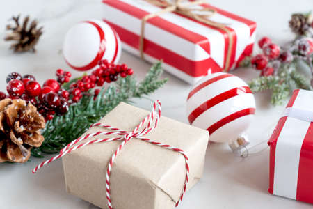 Christmas or New Year holiday presents wrapped in craft and striped paper with ribbon. handmade gift...
