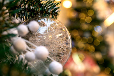 Christmas and New Year holidays background. Christmas tree decorated with white trnsparent ball. Celebration conceptの写真素材