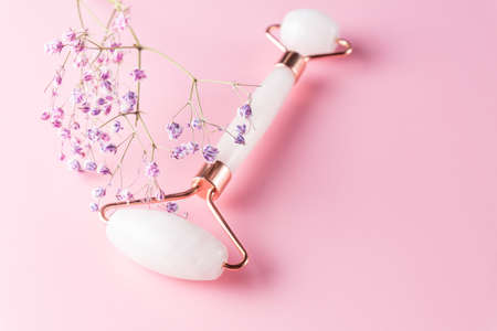 Massage with a quartz roller for the face with pink natural jade. Gouache massage tool. Anti-aging...