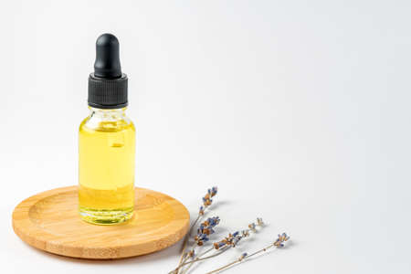 Lavender essential oil or serum with lavender extract on white background. Eco friendly natural...