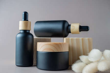 Set of natural cosmetic products in eco-friendly bamboo bottles and jar. Organic moisturizer cream...