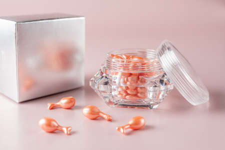 Skin care capsules offering single dose of beauty product. Face treatment daily routine for healthy and young skin. Mockup for designers.の写真素材