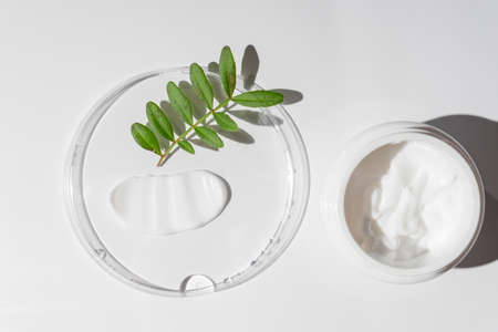 White cosmetic cream strokes on white background. Skincare lotion face serum smear. Beauty product...