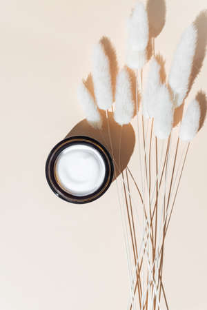 Skincare cosmetics, face cream moisturiser jar on beige background, beauty product flatlay close-up.の写真素材