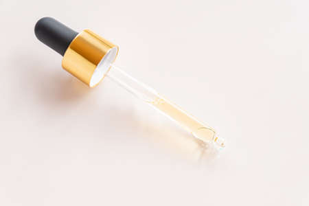 Dropper glass bottle branding mockup. cosmetic pipette. Trendy Concept of organic and beauty...