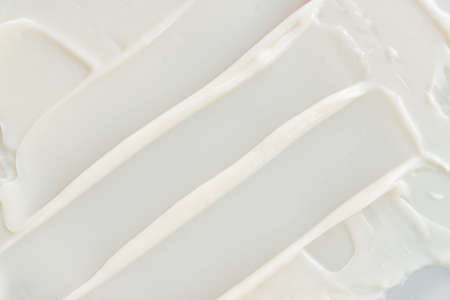 White cosmetic cream lotion moisturizer strokes. Hygiene, skincare product creamy texture. Beauty...