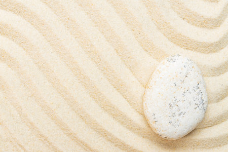 Japanese ZEN garden with stone in sand. Top view with copy space. Meditation amd yoga presentation.の写真素材