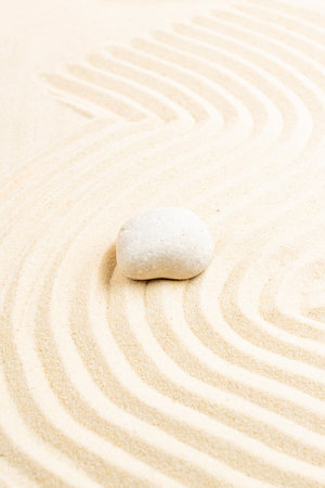 Japanese Zen stone garden. relaxation, meditation, simplicity and balance concept. pebbles and wavy sand tranquil calm scene.の写真素材