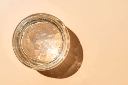 Transparent cosmetic liquid in glass jar. Tonic or toner gel aloe serum. mockup.